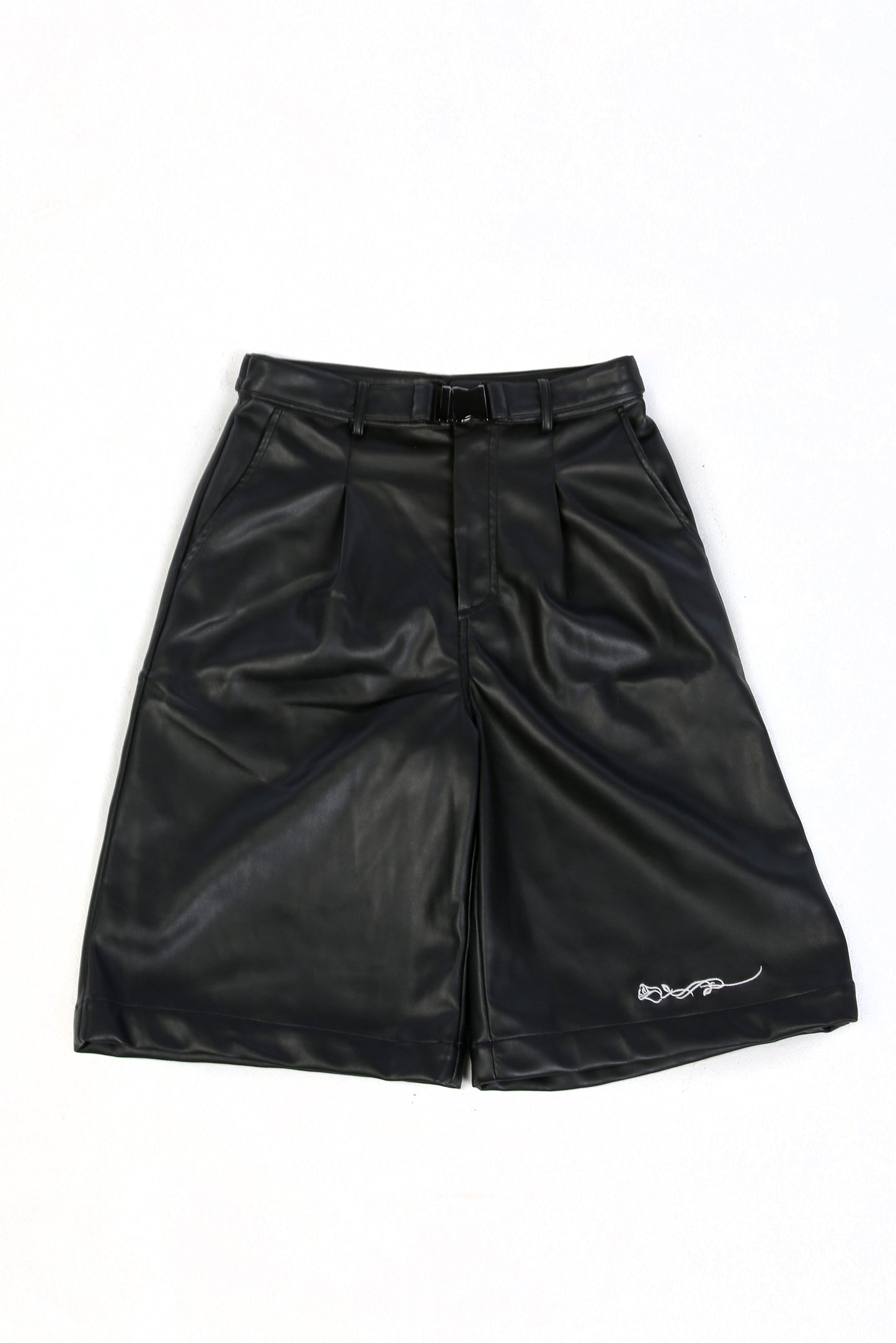 Black faux leather wide leg shorts with buckled belt strap